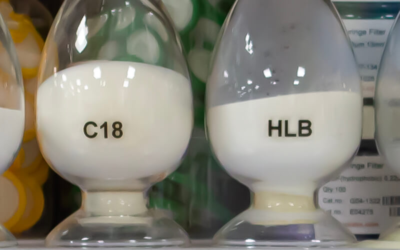 Two pots of SPE materials. C18 and HLB. At Poseidon-Scientific